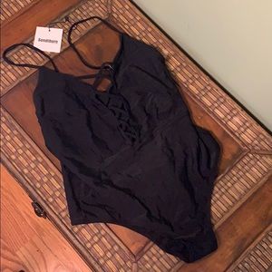 Black one piece with crisscross on front